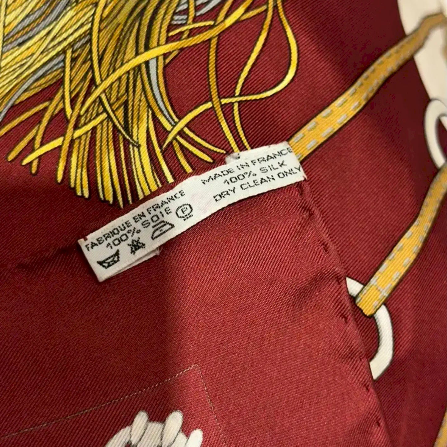 HERMÈS CLIQUETIS BURGUNDY AND GOLD SILK SCARF