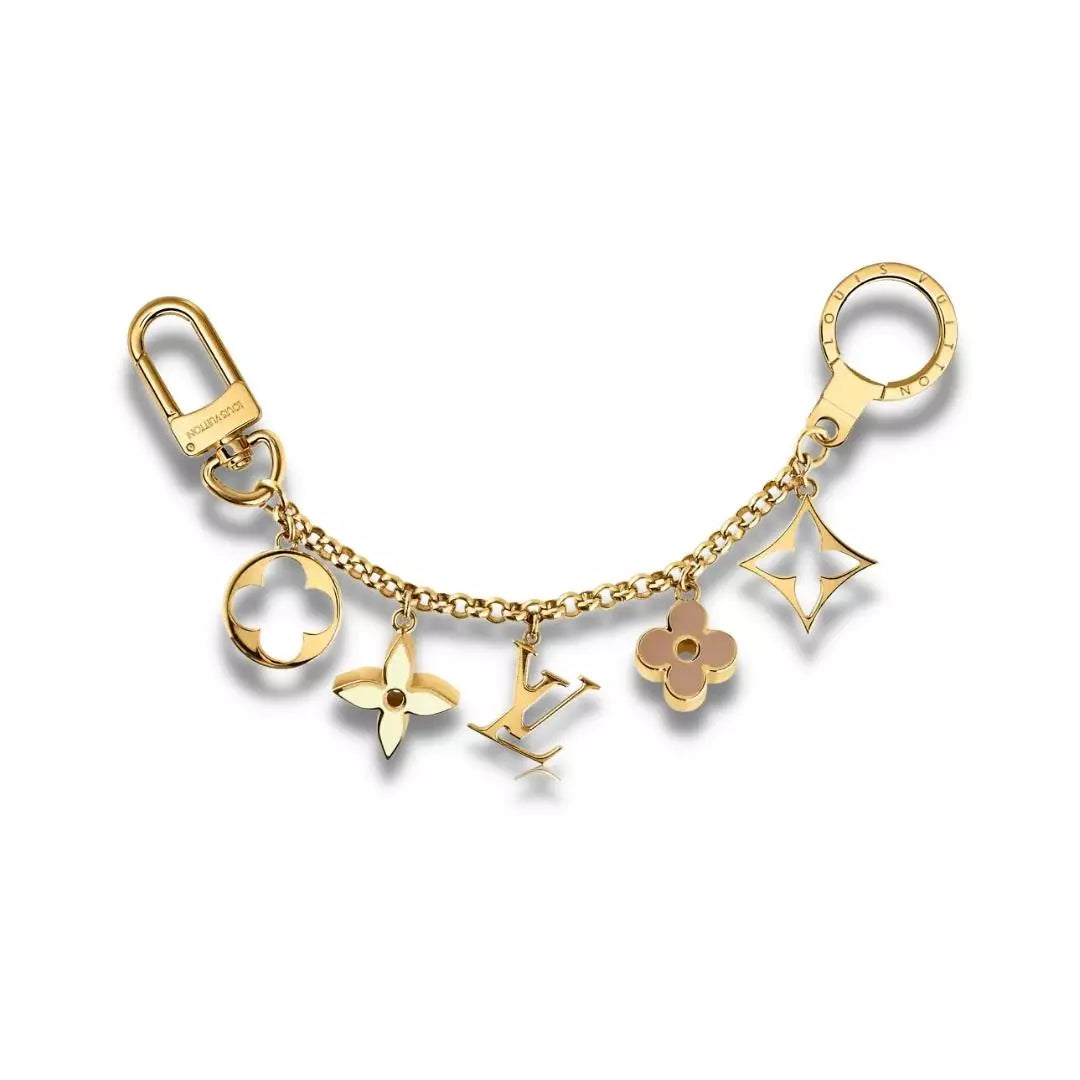 COLGANTE ICÓNICO Y LLAVERO LOUIS VUITTON FLEUR DE MONOGRAMA