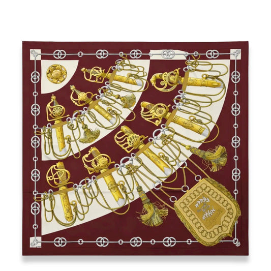HERMÈS CLIQUETIS BURGUNDY AND GOLD SILK SCARF