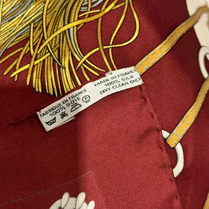 HERMÈS CLIQUETIS BURGUNDY AND GOLD SILK SCARF