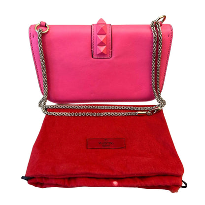 BOLSO DE VALENTINO CON CADENA Y CIERRE ROCKSTUD GLAM ROSA Y BLANCO