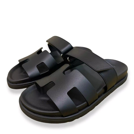 HERMÈS BLACK LEATHER CHYPRE SANDALS