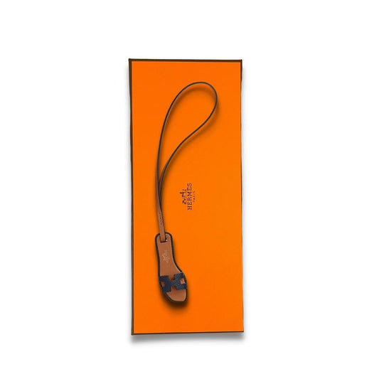 CHARM NANO NEGRO NARANJA DE HERMÈS 